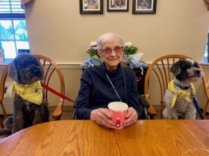 Evie H with 2 therapy dogs