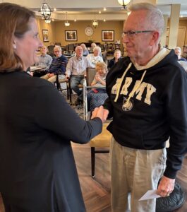 Army veteran shaking hands with Lifesong staff